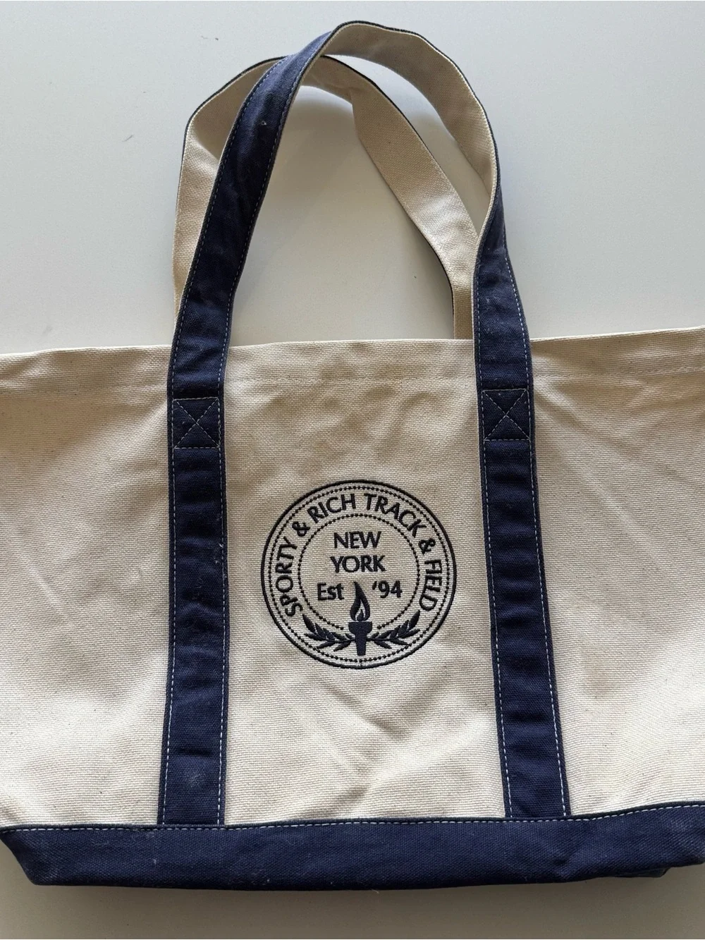 Sporty & Rich Cream Canvas Tote with Navy Trim and Logo